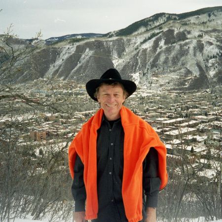 Sam Wyly took a picture by a snow covered hill. 